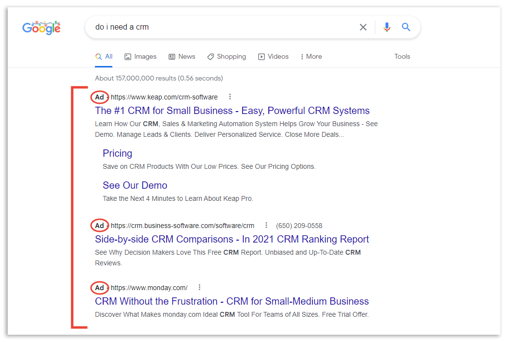 Trang kết quả Google với ba quảng cáo trên cùng được khoanh đỏ, mỗi dòng gắn nhãn Ad